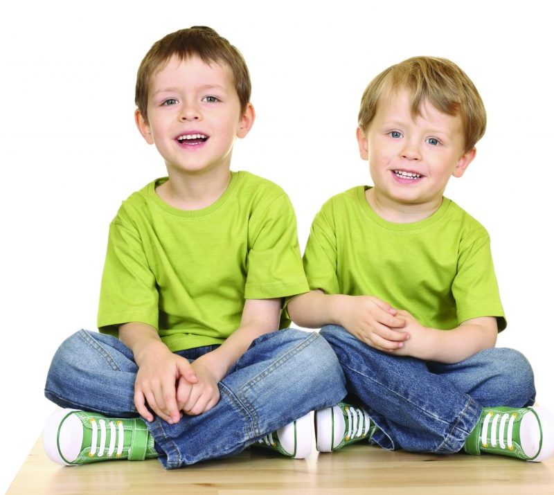 Two smiling toddlers