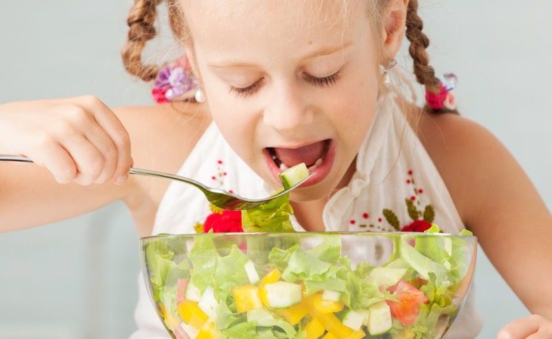 Girl eating salad